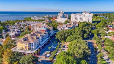 Escape to coastal luxury in this exquisite two-bedroom two-bath on Sandestin Golf and Beach Resort - Raven in Florida - for sale on GolfHomes.com, golf home, golf lot