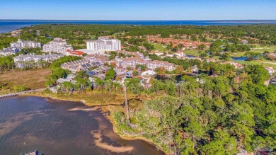 Escape to coastal luxury in this exquisite two-bedroom two-bath on Sandestin Golf and Beach Resort - Raven in Florida - for sale on GolfHomes.com, golf home, golf lot