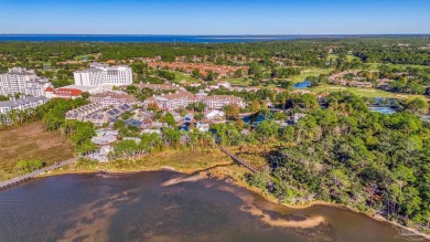 Escape to coastal luxury in this exquisite two-bedroom two-bath on Sandestin Golf and Beach Resort - Raven in Florida - for sale on GolfHomes.com, golf home, golf lot