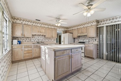 Investor Special in Sun City Center - Spacious 2/2 Fixer Upper on Caloosa Greens Executive Golf Course in Florida - for sale on GolfHomes.com, golf home, golf lot