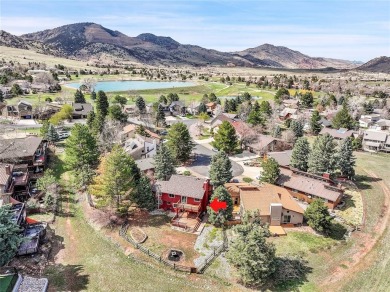 SITTING ON THE GOLF COURSE with both **mountain and city views** on Red Rocks Country Club in Colorado - for sale on GolfHomes.com, golf home, golf lot