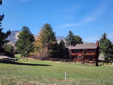 SITTING ON THE GOLF COURSE with both **mountain and city views** on Red Rocks Country Club in Colorado - for sale on GolfHomes.com, golf home, golf lot