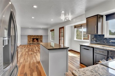 SITTING ON THE GOLF COURSE with both **mountain and city views** on Red Rocks Country Club in Colorado - for sale on GolfHomes.com, golf home, golf lot