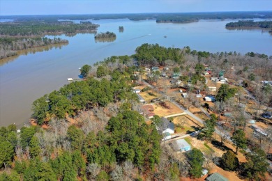 Discover the epitome of lakefront living in this breathtaking on Rocky Branch Golf Club in Georgia - for sale on GolfHomes.com, golf home, golf lot