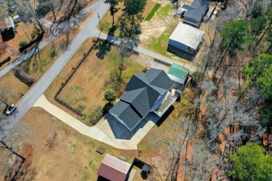 Discover the epitome of lakefront living in this breathtaking on Rocky Branch Golf Club in Georgia - for sale on GolfHomes.com, golf home, golf lot