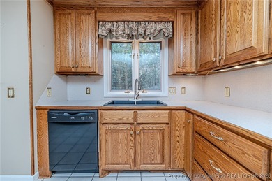 Experience comfortable, low-maintenance living in the gated golf on Carolina Trace Country Club in North Carolina - for sale on GolfHomes.com, golf home, golf lot