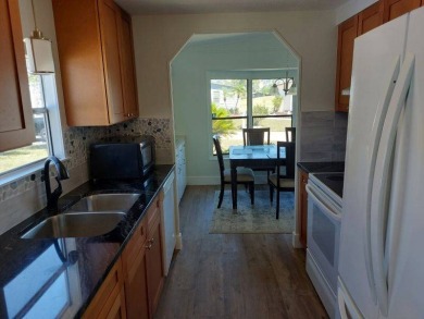 Beautifully updated center cul-de-sac partially furnished home on Lake Fairways Country Club in Florida - for sale on GolfHomes.com, golf home, golf lot