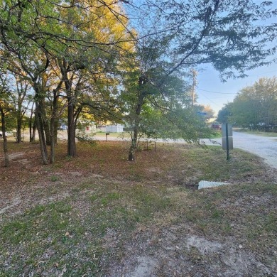 Wooded corner lot available in a lakefront community on Lake on Tawakoni Golf Course in Texas - for sale on GolfHomes.com, golf home, golf lot