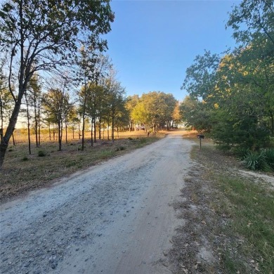 Wooded corner lot available in a lakefront community on Lake on Tawakoni Golf Course in Texas - for sale on GolfHomes.com, golf home, golf lot