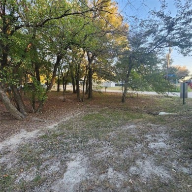 Wooded corner lot available in a lakefront community on Lake on Tawakoni Golf Course in Texas - for sale on GolfHomes.com, golf home, golf lot