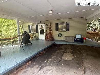 Welcome to 61 River Loop - a quaint mountain retreat located in on Land Harbor Golf Course in North Carolina - for sale on GolfHomes.com, golf home, golf lot