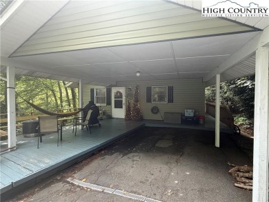 Welcome to 61 River Loop - a quaint mountain retreat located in on Land Harbor Golf Course in North Carolina - for sale on GolfHomes.com, golf home, golf lot