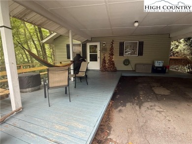 Welcome to 61 River Loop - a quaint mountain retreat located in on Land Harbor Golf Course in North Carolina - for sale on GolfHomes.com, golf home, golf lot