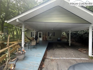 Welcome to 61 River Loop - a quaint mountain retreat located in on Land Harbor Golf Course in North Carolina - for sale on GolfHomes.com, golf home, golf lot