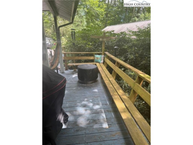 Welcome to 61 River Loop - a quaint mountain retreat located in on Land Harbor Golf Course in North Carolina - for sale on GolfHomes.com, golf home, golf lot