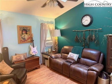 Welcome to 61 River Loop - a quaint mountain retreat located in on Land Harbor Golf Course in North Carolina - for sale on GolfHomes.com, golf home, golf lot