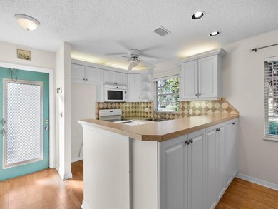 Welcome to this charming 2-bedroom, 2-bath first-floor corner on The American Golf Club in Florida - for sale on GolfHomes.com, golf home, golf lot