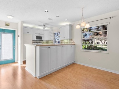 Welcome to this charming 2-bedroom, 2-bath first-floor corner on The American Golf Club in Florida - for sale on GolfHomes.com, golf home, golf lot