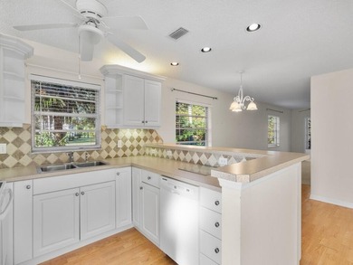 Welcome to this charming 2-bedroom, 2-bath first-floor corner on The American Golf Club in Florida - for sale on GolfHomes.com, golf home, golf lot