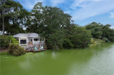 This charming and comfortable bungalow offers beautiful views of on Sea Island Golf Club in Georgia - for sale on GolfHomes.com, golf home, golf lot