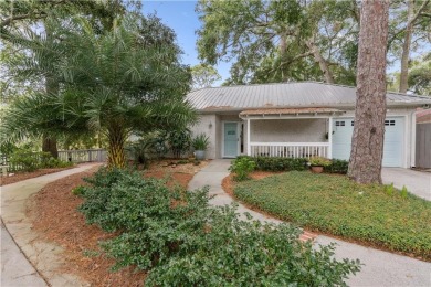 This charming and comfortable bungalow offers beautiful views of on Sea Island Golf Club in Georgia - for sale on GolfHomes.com, golf home, golf lot