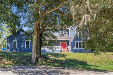 This traditional farmhouse blends Old Florida charm with on Isleworth Golf and Country Club in Florida - for sale on GolfHomes.com, golf home, golf lot