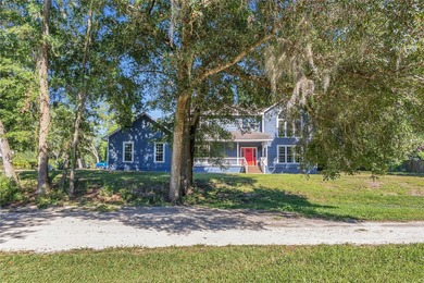 This traditional farmhouse blends Old Florida charm with on Isleworth Golf and Country Club in Florida - for sale on GolfHomes.com, golf home, golf lot