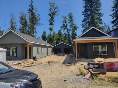 Charming 2-bedroom, 2-bath cottage nestled in a peaceful on Sandpoint Elks Golf Course in Idaho - for sale on GolfHomes.com, golf home, golf lot