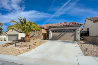 This stunning home offers exceptional curb appeal with elegant on Revere Golf Club in Nevada - for sale on GolfHomes.com, golf home, golf lot