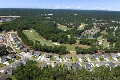 Pristine 2024 Mid-South Club home on an elevated lot with thick on Mid South Club in North Carolina - for sale on GolfHomes.com, golf home, golf lot