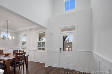 Pristine 2024 Mid-South Club home on an elevated lot with thick on Mid South Club in North Carolina - for sale on GolfHomes.com, golf home, golf lot