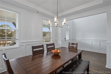 Pristine 2024 Mid-South Club home on an elevated lot with thick on Mid South Club in North Carolina - for sale on GolfHomes.com, golf home, golf lot