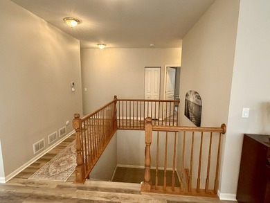 Delightful, sun-filled ranch with a finished basement nestled in on Carillon Lakes 3 Hole Course in Illinois - for sale on GolfHomes.com, golf home, golf lot