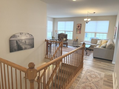 Delightful, sun-filled ranch with a finished basement nestled in on Carillon Lakes 3 Hole Course in Illinois - for sale on GolfHomes.com, golf home, golf lot