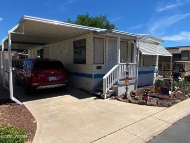 This cozy park model features 2 full bathrooms, a 40 gal hot on Juniper Ridge R.V. Golf Resort in Arizona - for sale on GolfHomes.com, golf home, golf lot