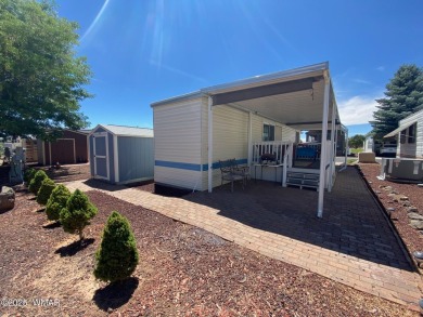 This cozy park model features 2 full bathrooms, a 40 gal hot on Juniper Ridge R.V. Golf Resort in Arizona - for sale on GolfHomes.com, golf home, golf lot