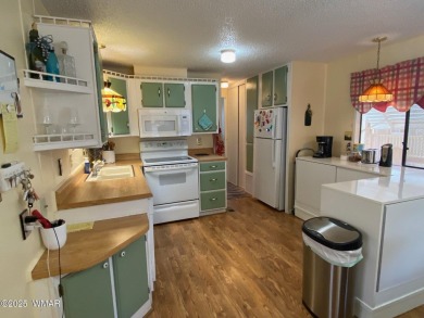 This cozy park model features 2 full bathrooms, a 40 gal hot on Juniper Ridge R.V. Golf Resort in Arizona - for sale on GolfHomes.com, golf home, golf lot