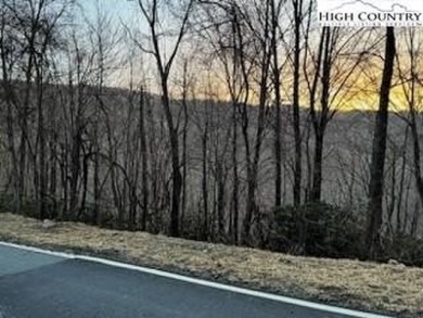 This buildable third acre lot is located close to Buckeye Lake on Beech Mountain Club in North Carolina - for sale on GolfHomes.com, golf home, golf lot