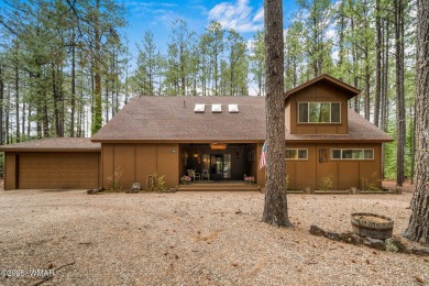 Set on a beautiful 0.52-acre lot surrounded by towering pines on Pinetop Lakes Country Club in Arizona - for sale on GolfHomes.com, golf home, golf lot