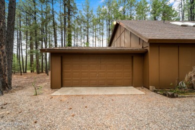 Set on a beautiful 0.52-acre lot surrounded by towering pines on Pinetop Lakes Country Club in Arizona - for sale on GolfHomes.com, golf home, golf lot