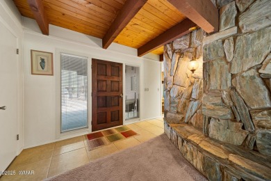 Set on a beautiful 0.52-acre lot surrounded by towering pines on Pinetop Lakes Country Club in Arizona - for sale on GolfHomes.com, golf home, golf lot