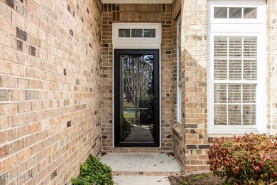 Welcome to easy living in this beautifully maintained home on Sandpiper Bay Golf and Country Club in North Carolina - for sale on GolfHomes.com, golf home, golf lot