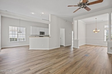 Welcome to easy living in this beautifully maintained home on Sandpiper Bay Golf and Country Club in North Carolina - for sale on GolfHomes.com, golf home, golf lot