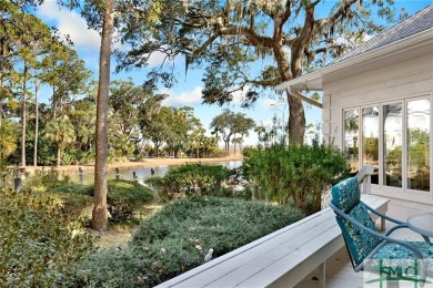 From stunning curb appeal to breathtaking views across 2 lagoons on The Landings Club - Palmetto in Georgia - for sale on GolfHomes.com, golf home, golf lot