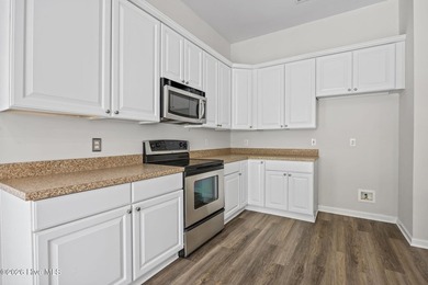 Welcome to easy living in this beautifully maintained home on Sandpiper Bay Golf and Country Club in North Carolina - for sale on GolfHomes.com, golf home, golf lot