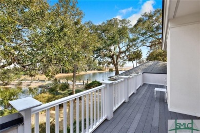 From stunning curb appeal to breathtaking views across 2 lagoons on The Landings Club - Palmetto in Georgia - for sale on GolfHomes.com, golf home, golf lot