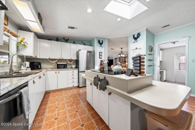 Charming 2-Bedroom Home with Golf Course Views! This on Barefoot Bay Golf Course in Florida - for sale on GolfHomes.com, golf home, golf lot