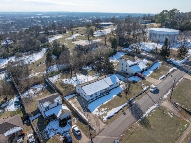 Welcome to this beautifully updated home, conveniently located on Cedars Country Club in Arkansas - for sale on GolfHomes.com, golf home, golf lot