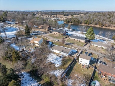 Welcome to this beautifully updated home, conveniently located on Cedars Country Club in Arkansas - for sale on GolfHomes.com, golf home, golf lot