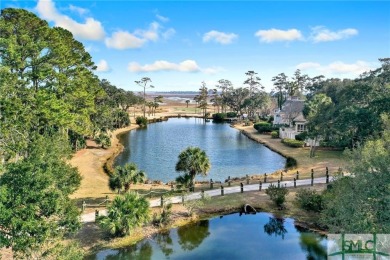 From stunning curb appeal to breathtaking views across 2 lagoons on The Landings Club - Palmetto in Georgia - for sale on GolfHomes.com, golf home, golf lot